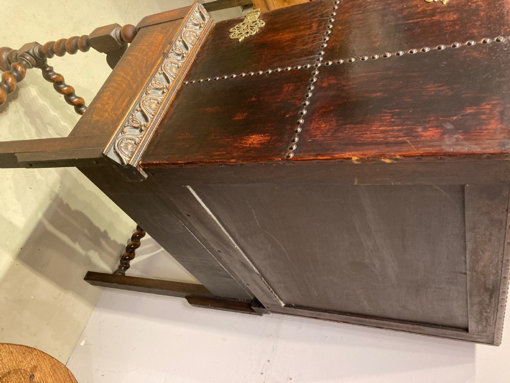 Antique oak leather bound cocktail cabinet. View VII