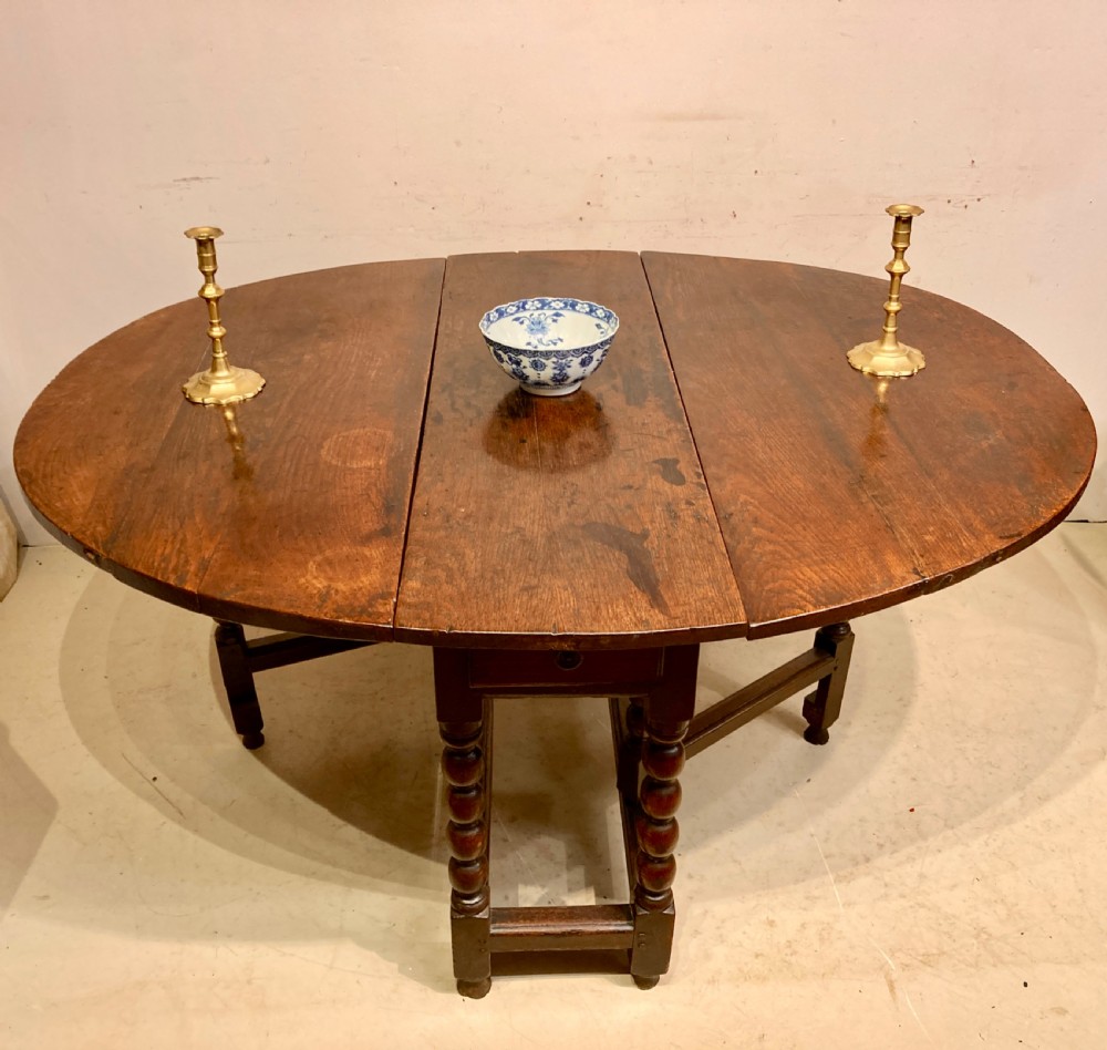 Charles II oak gateleg dining table.