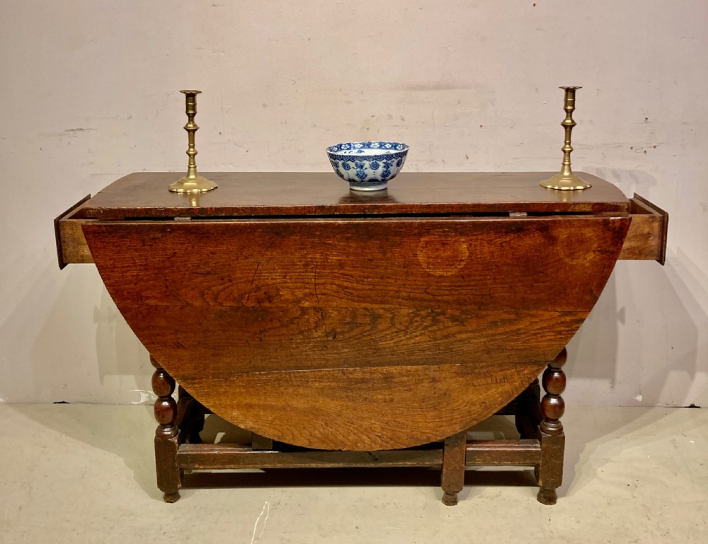 Charles II oak gateleg dining table. View III