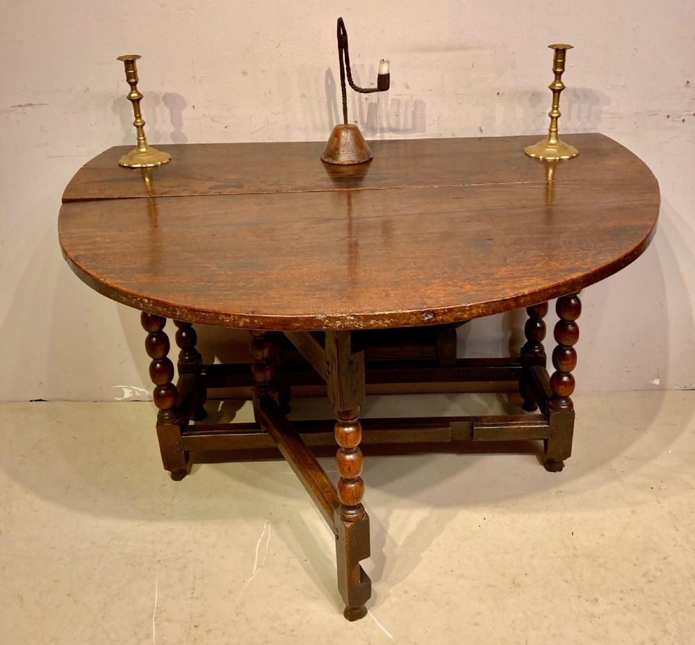 Charles II oak gateleg dining table. View IV