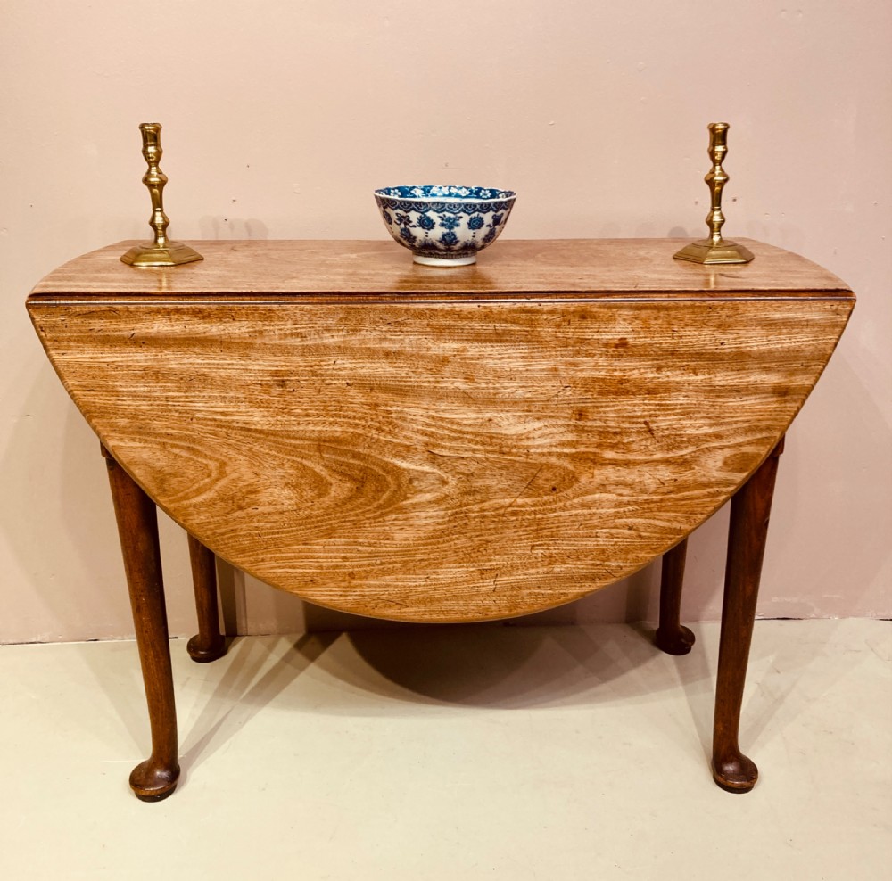 Geo II mahogany drop leaf table.