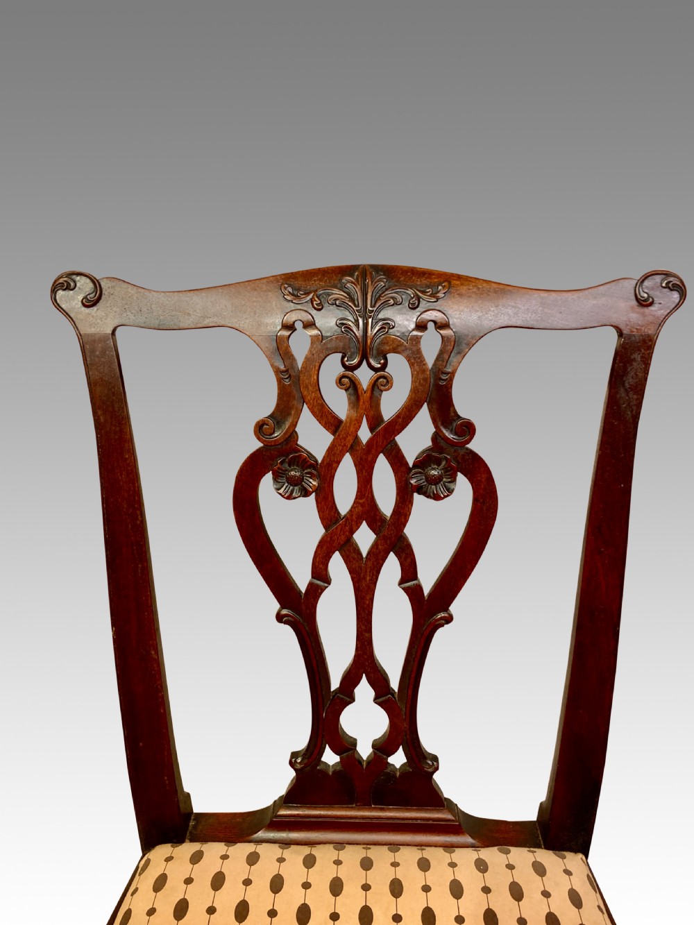 Set of ten Chippendale mahogany dining chairs. View IX