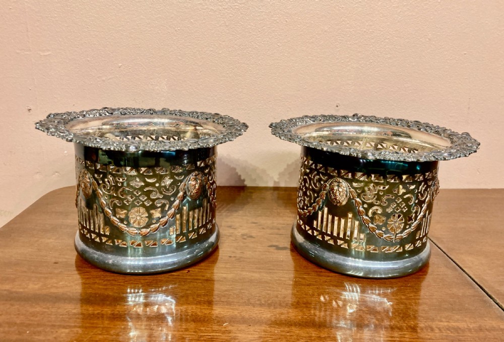 Pair of Sheffield plated wine coasters.