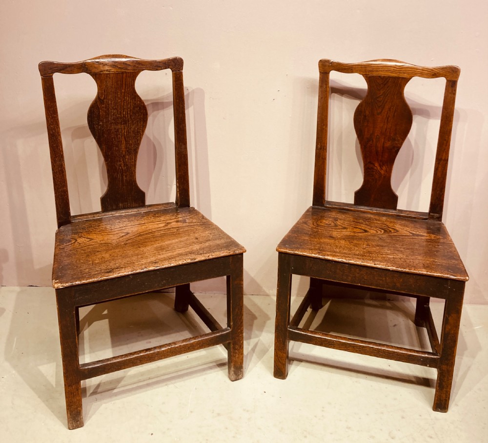 Pair of Georgian country elm side chairs.