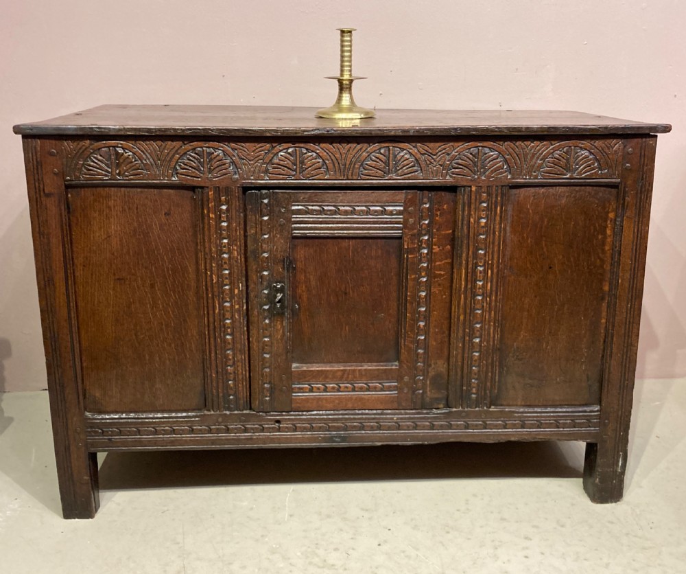 Charles II carved oak cupboard.