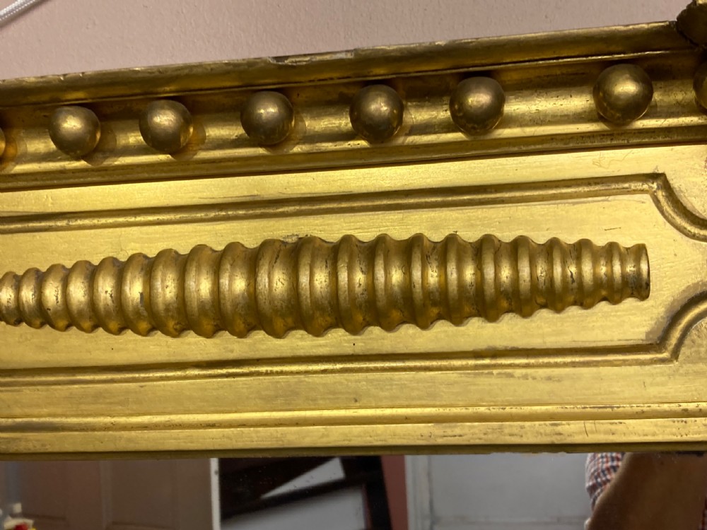Regency carved giltwood pier mirror. View II