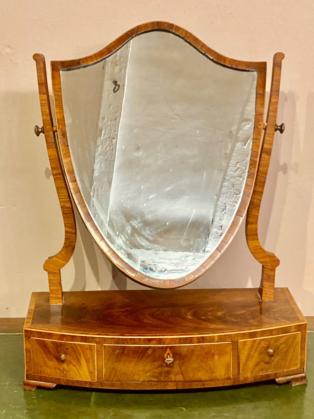 Georgian mahogany shield shaped dressing table mirror.
