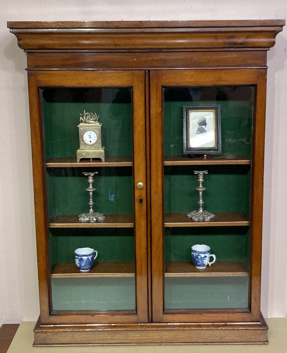 Small Victorian mahogany glazed door hanging cabinet.