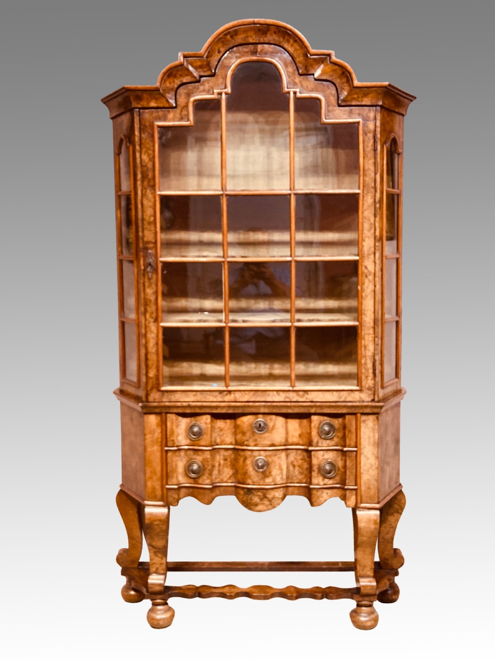 Small antique burr walnut cabinet on stand.