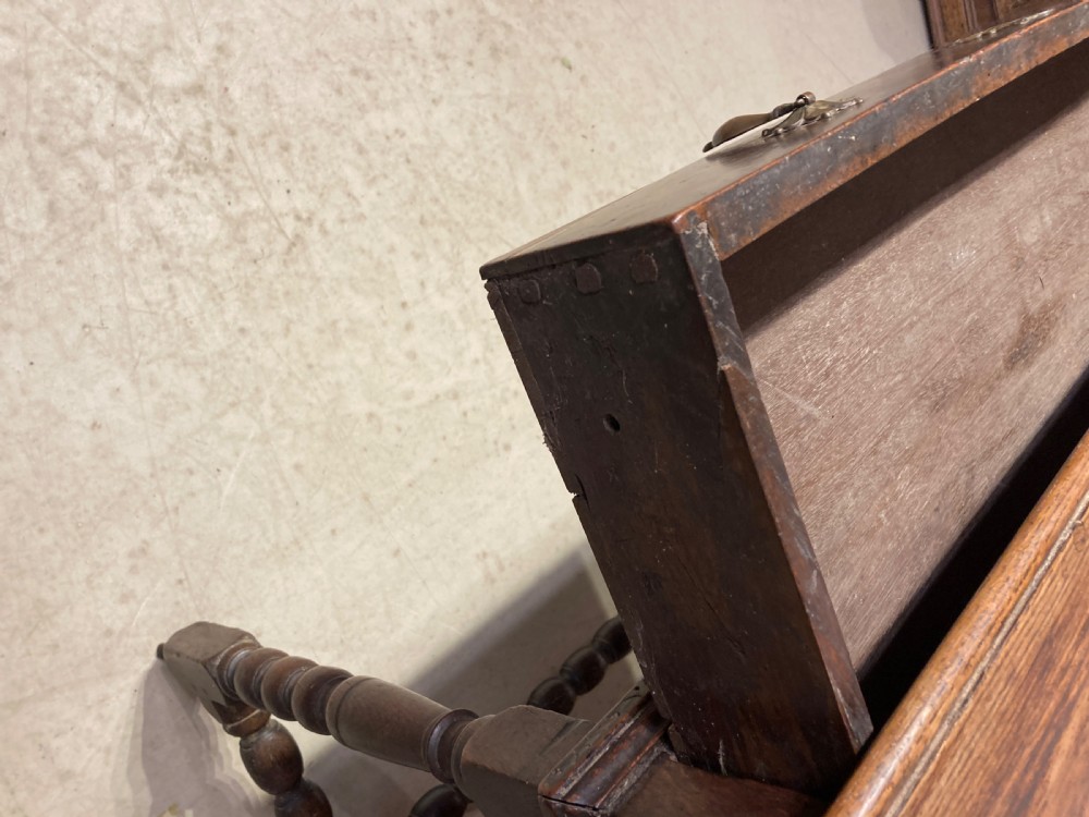 An 18th-century oak and elm side table featuring a single drawer with brass handles, turned legs, and a bobbin stretcher. View III
