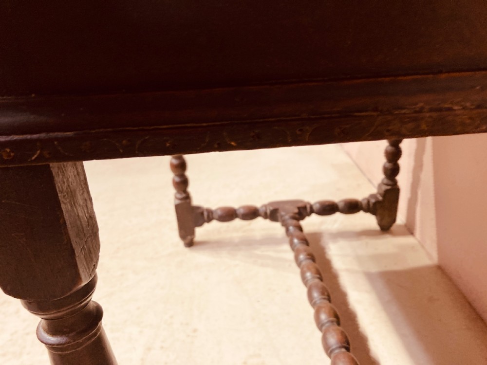 An 18th-century oak and elm side table featuring a single drawer with brass handles, turned legs, and a bobbin stretcher. View VI