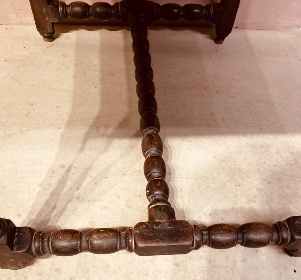 An 18th-century oak and elm side table featuring a single drawer with brass handles, turned legs, and a bobbin stretcher. View VII