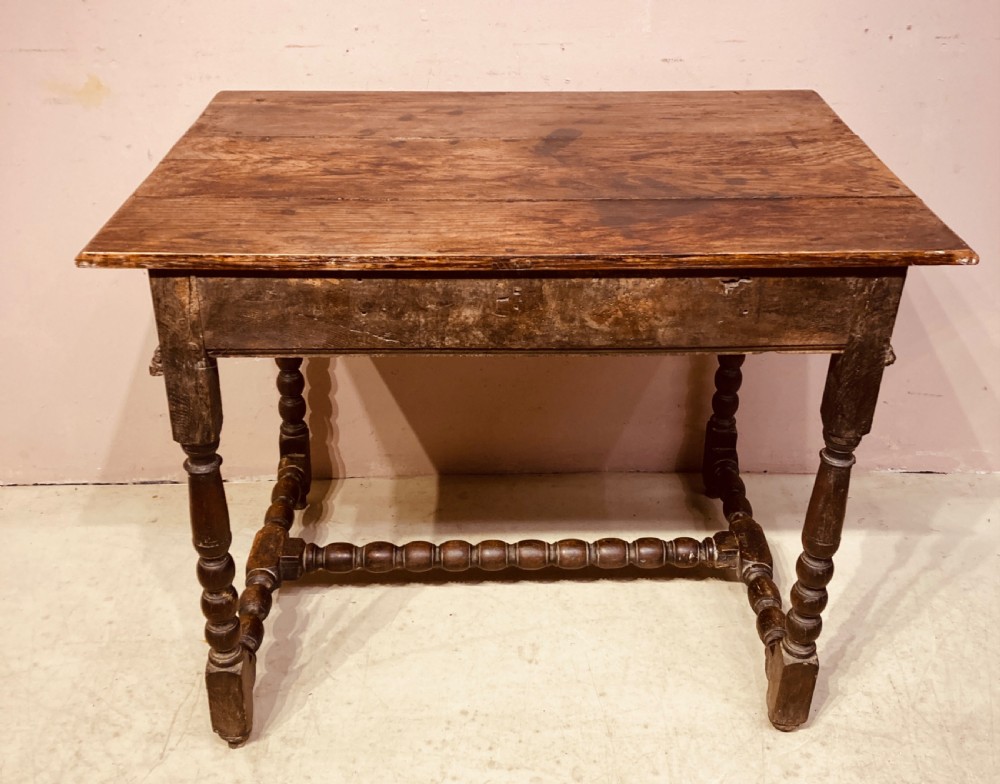 An 18th-century oak and elm side table featuring a single drawer with brass handles, turned legs, and a bobbin stretcher. View IX