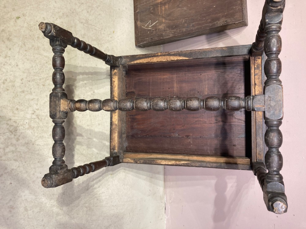 An 18th-century oak and elm side table featuring a single drawer with brass handles, turned legs, and a bobbin stretcher. View XI