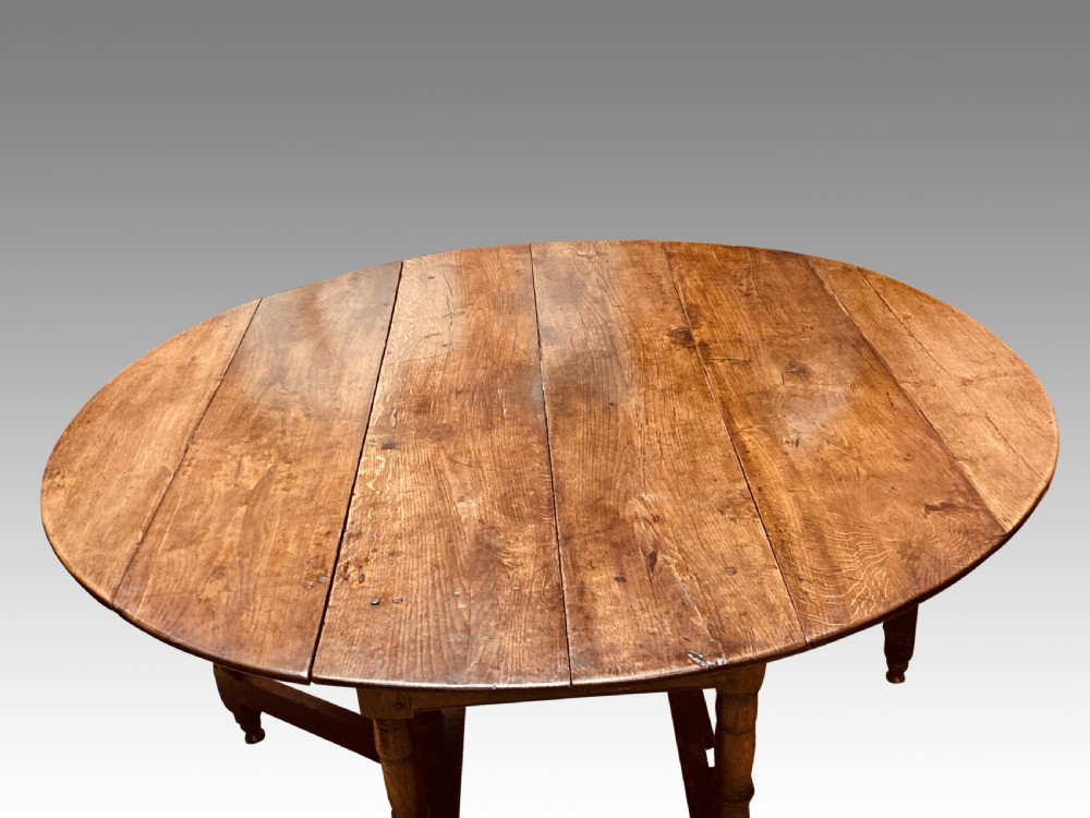 Queen Anne oak gateleg dining table. View IV