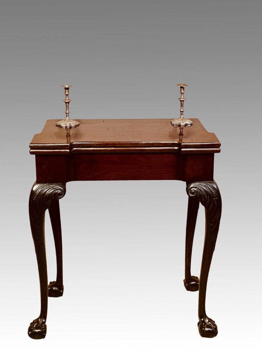 Antique Irish mahogany tea table .
