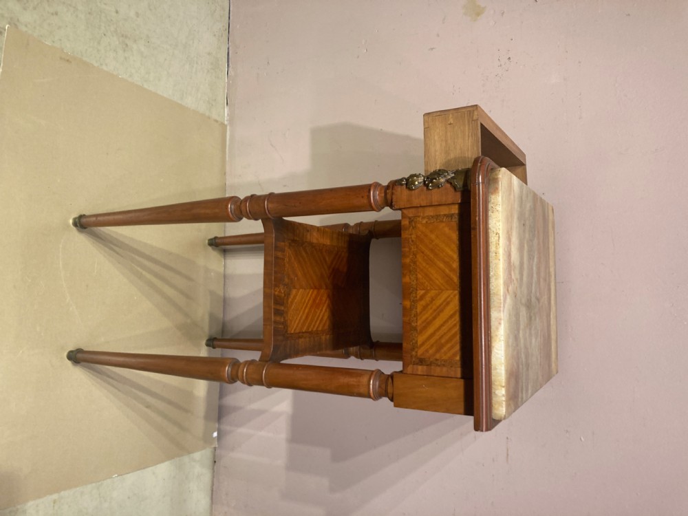 A rectangular French Louis XVI style side table featuring a marble top, chevron parquetry veneer, turned legs with gilt brass mounts, and a lower tier shelf. View III