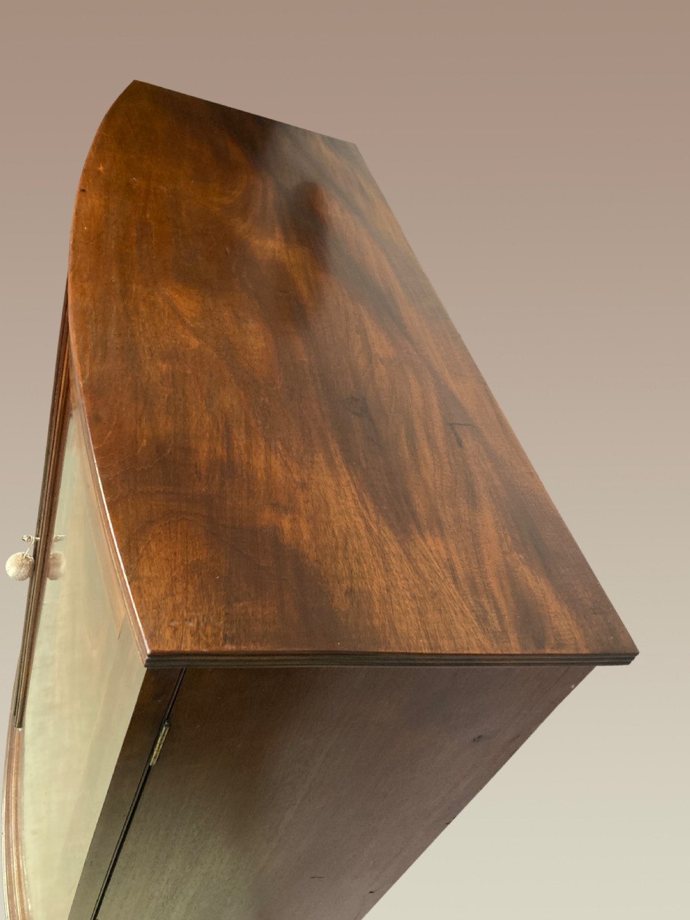 Georgian mahogany bow fronted linen cupboard. View II