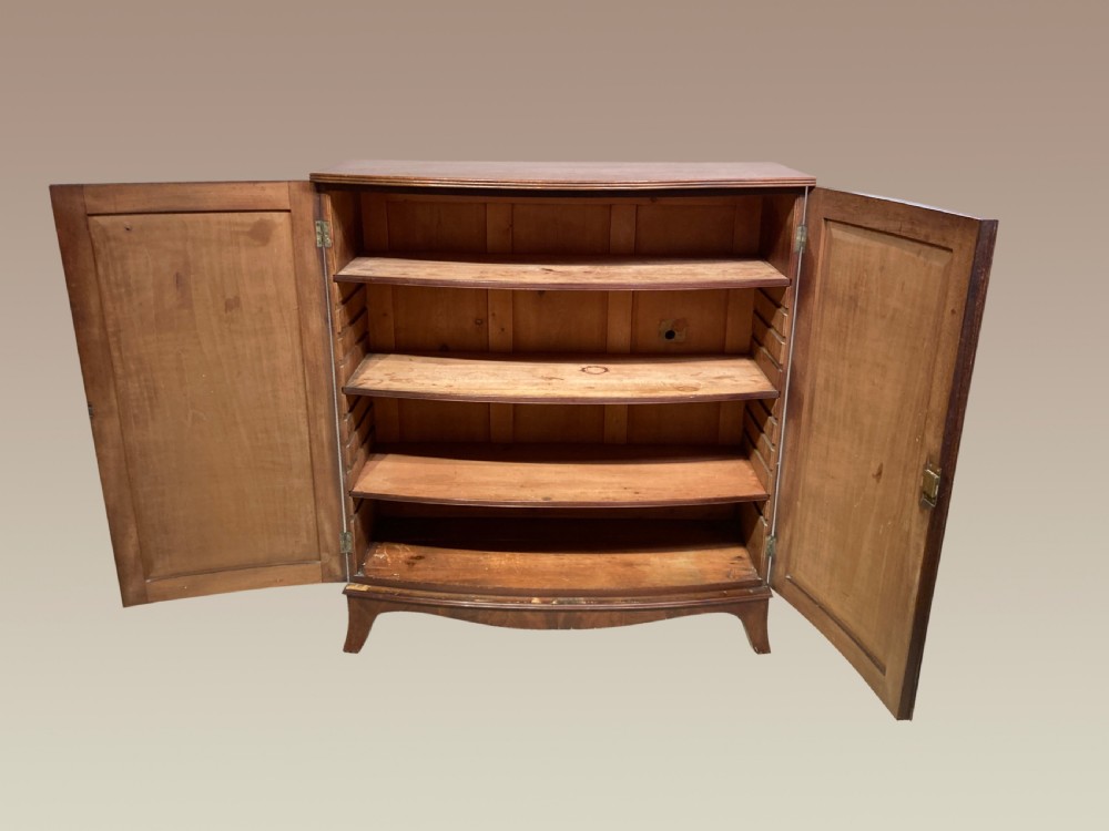 Georgian mahogany bow fronted linen cupboard. View III