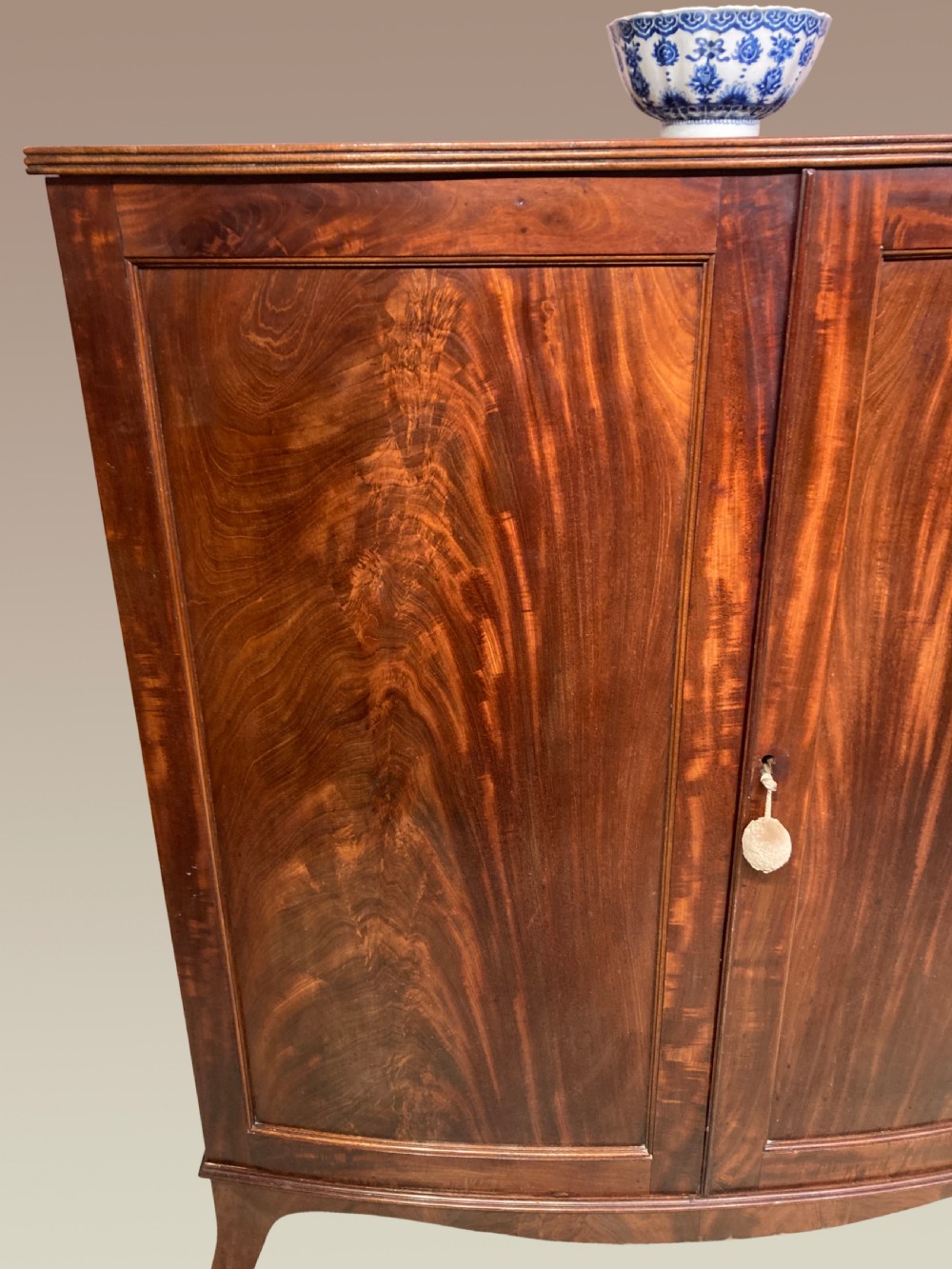 Georgian mahogany bow fronted linen cupboard. View V
