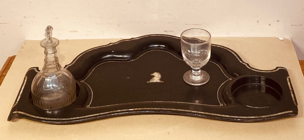 A black lacquered Georgian papier-mache tray featuring mother of pearl inlay along the scalloped rim and a central crest motif. View VI