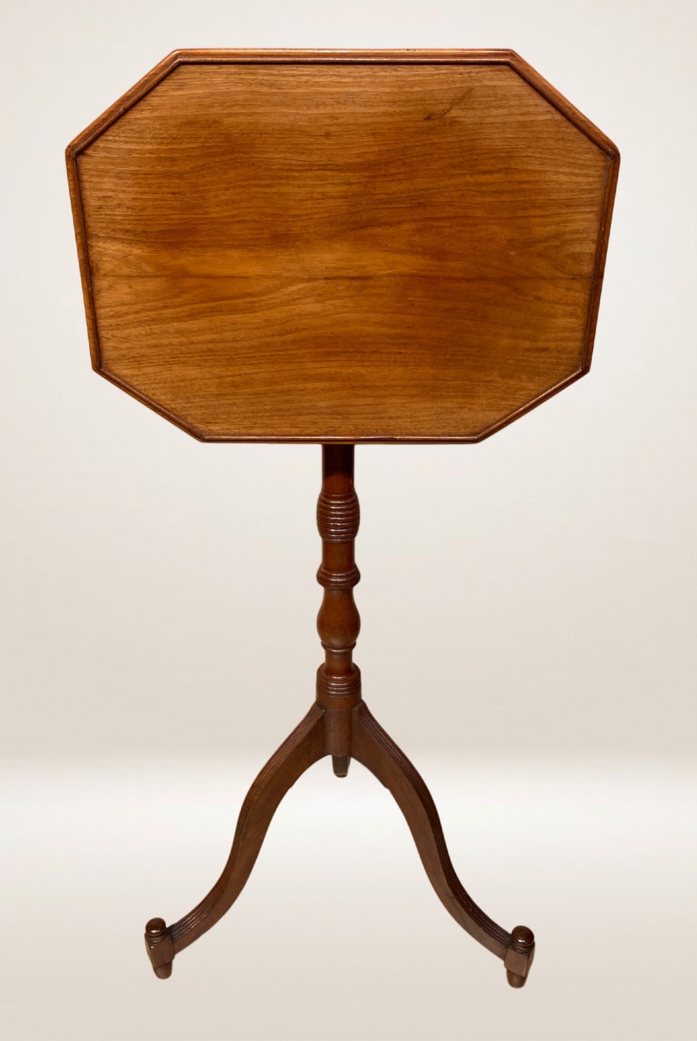 A Georgian mahogany lamp table featuring an octagonal top supported by a turned central column on a tripod base. View III