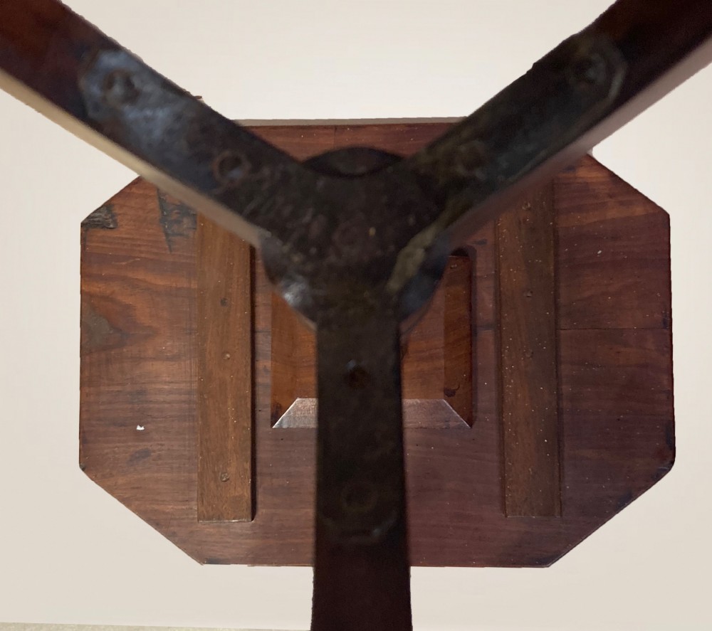A Georgian mahogany lamp table featuring an octagonal top supported by a turned central column on a tripod base. View V