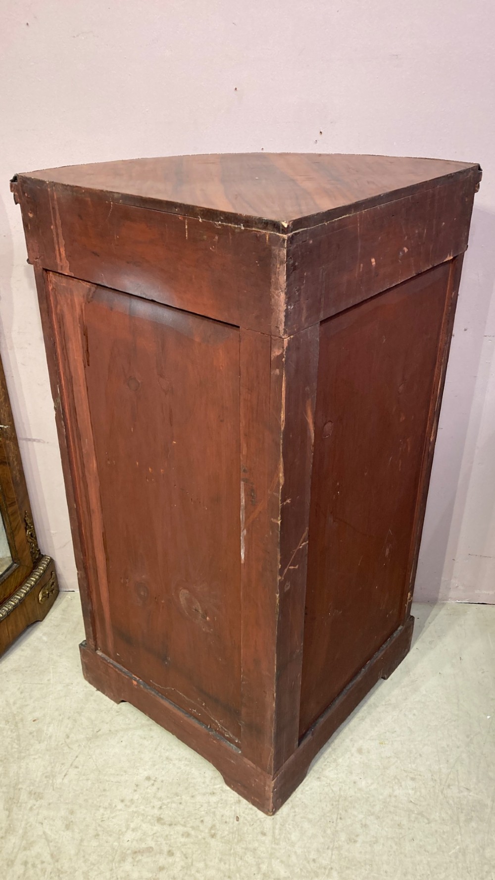 A pair of Victorian inlaid walnut corner cabinets featuring curved glass display doors, decorative floral marquetry, and gilt bronze mounts. View X