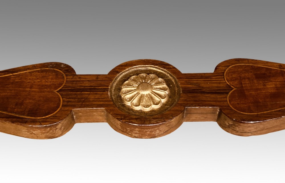 A 19th-century rosewood rectangular music bench featuring a cream upholstered seat, fluted legs, and a gilt decorative central panel on the frieze. View IX