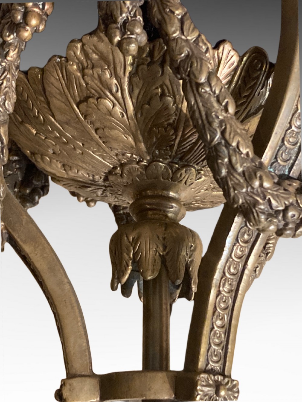 A pair of cobalt blue glazed ceramic urn-shaped table lamps mounted with gilt bronze ram head handles and festoons. View V