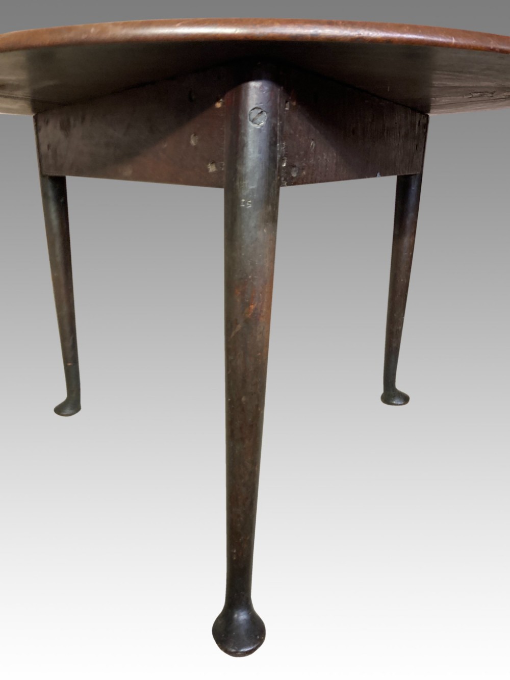 A Georgian red walnut drop-leaf table featuring a triangular top, drop flaps, and turned legs ending in pad feet. View IV