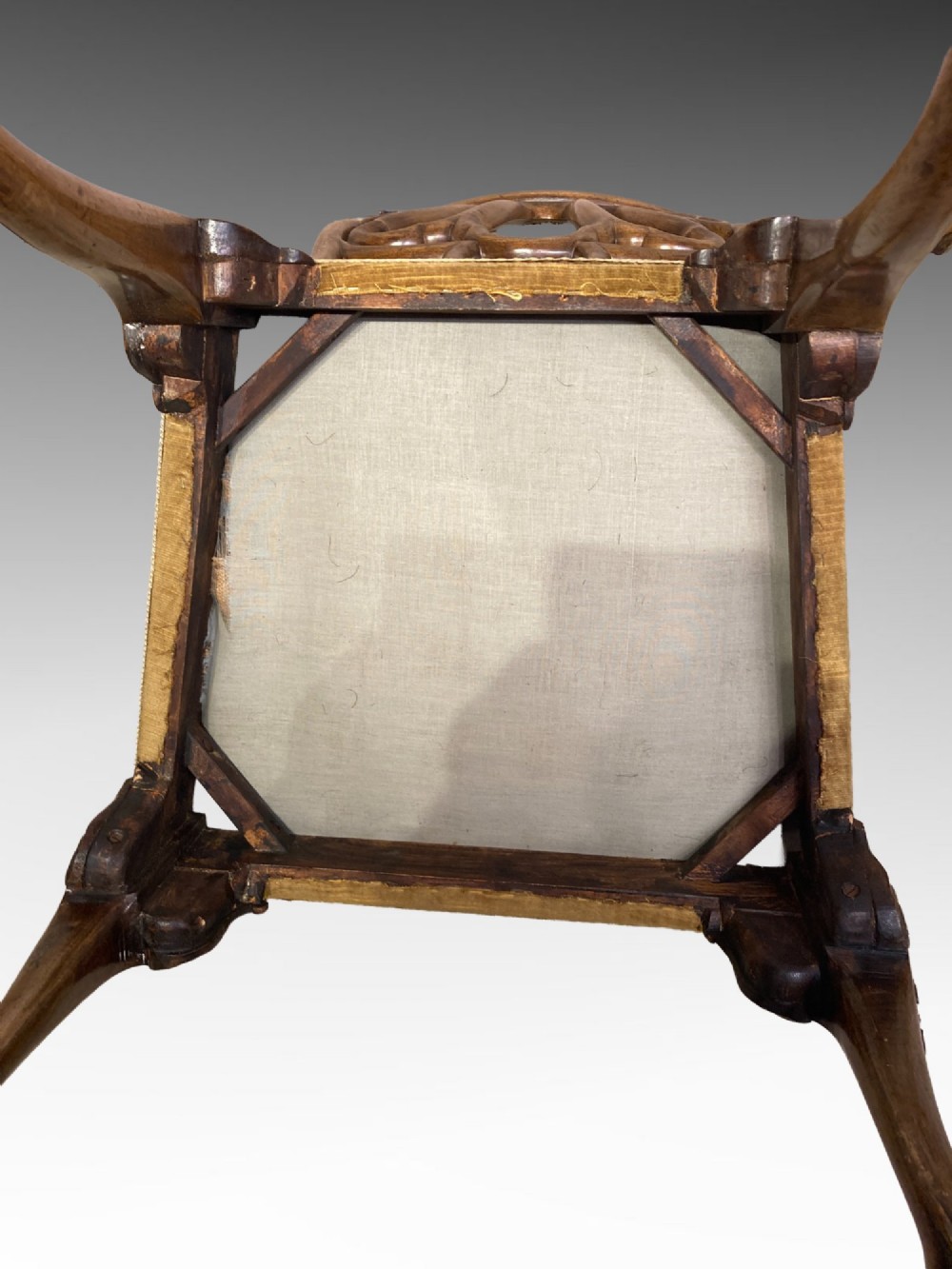 A pair of carved George II style walnut side chairs featuring open shell-form backs, upholstered gold velvet seats, and cabriole legs ending in ball and claw feet. View VII