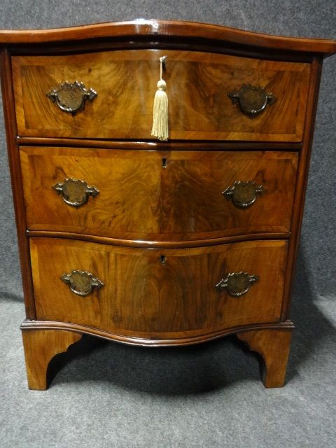 A Good Serpentine Burr Walnut Chest