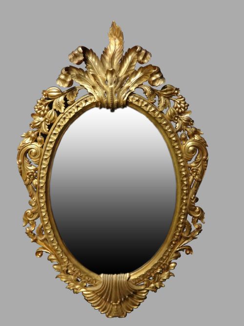 Fine and Large Carved Oval Giltwood Mirror