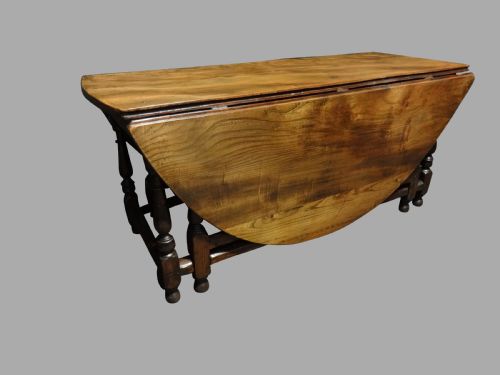 A Superb Huge Elm Drop Leaf Double Gate Dining Table