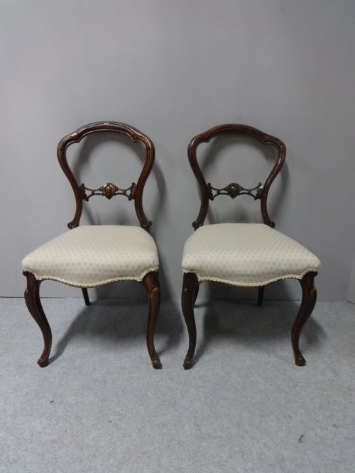 A Pair of Victorian Walnut Hall Chairs