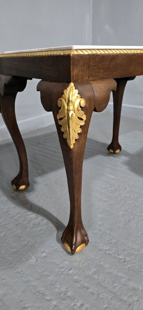 fig 1. A pair of rectangular dark mahogany lamp tables featuring white marble inset tops, gilded acanthus leaf carvings, and carved cabriole legs with ball and claw feet.
