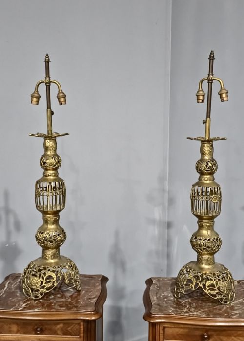 fig 1. A pair of tall, ornate cast brass table lamps featuring cage urn columns, pierced metalwork, and openwork bases.
