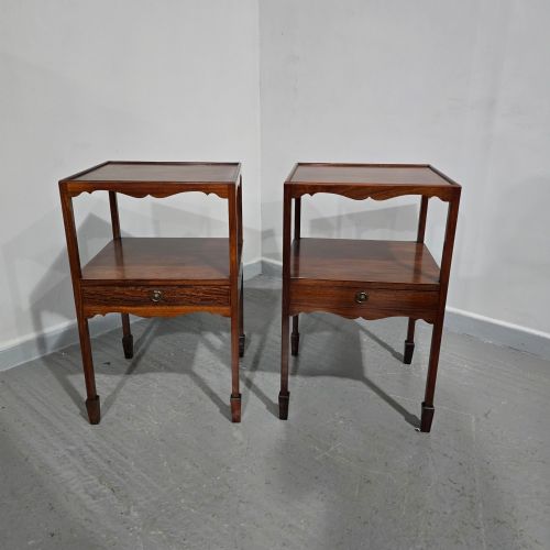 fig 1. A pair of Georgian mahogany lamp tables featuring tray top rims, middle open shelves, single drawers with brass knobs, and shaped aprons.