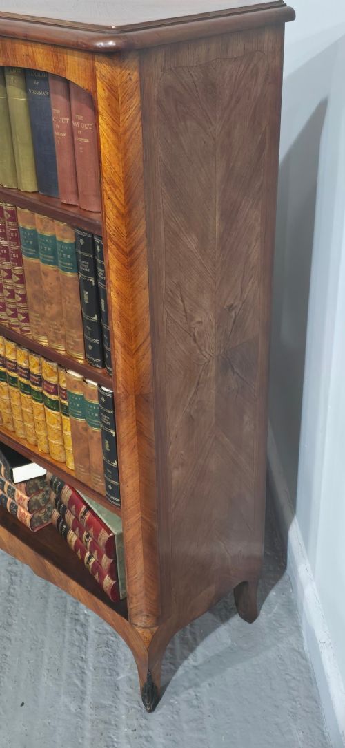 An open-fronted French walnut bookcase featuring adjustable internal shelves, a shaped apron, and short cabriole legs. View VIII