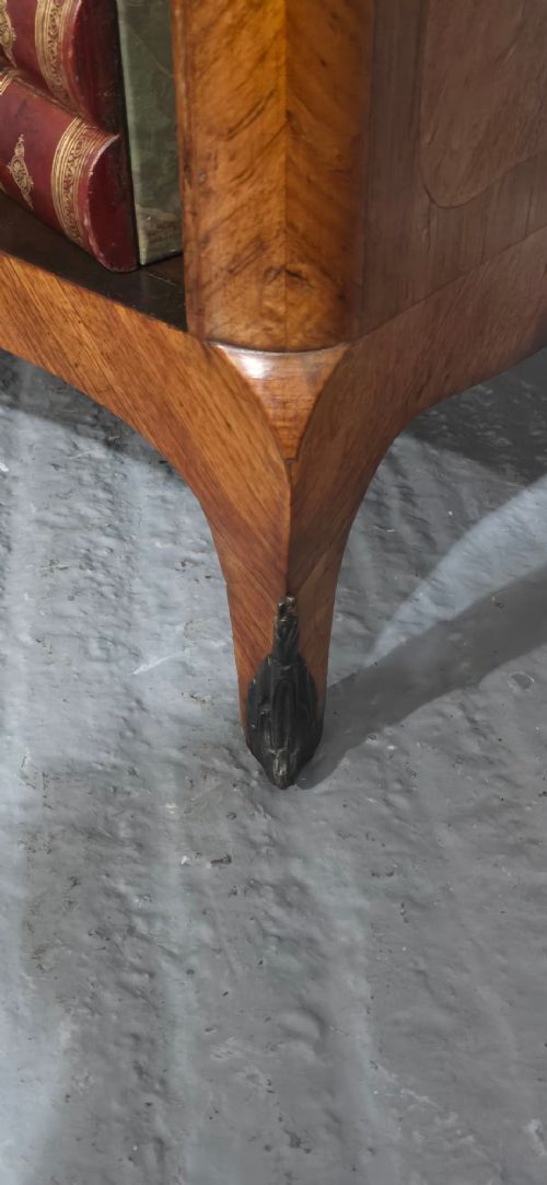 An open-fronted French walnut bookcase featuring adjustable internal shelves, a shaped apron, and short cabriole legs. View IX