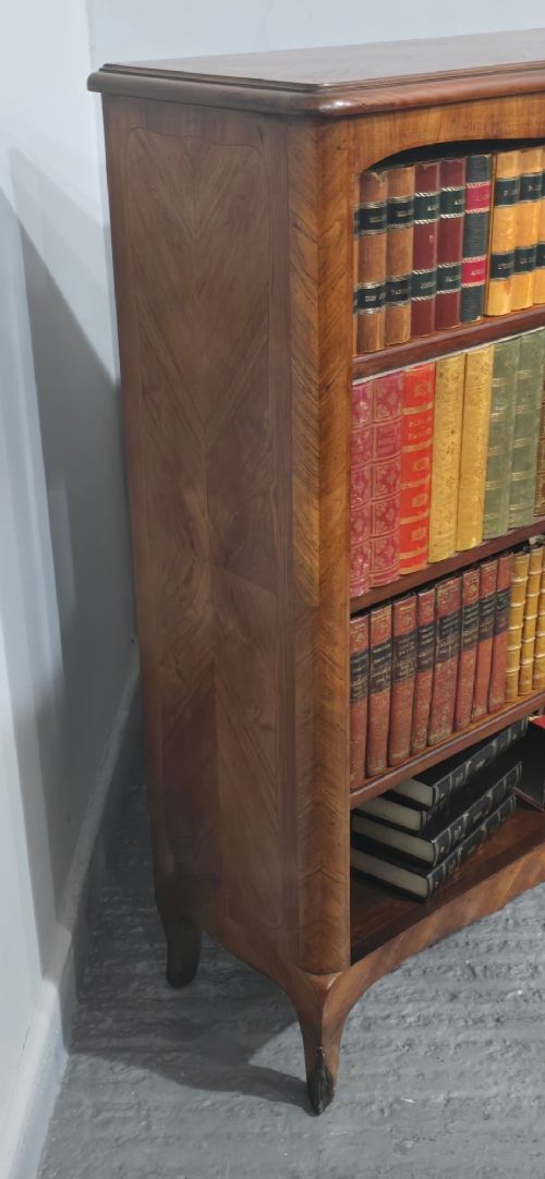 An open-fronted French walnut bookcase featuring adjustable internal shelves, a shaped apron, and short cabriole legs. View XII