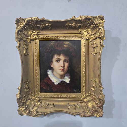 fig 1. An oil painting on board depicting a young woman with dark hair and a ruffled white collar, displayed within a heavily carved gold Rococo style frame.