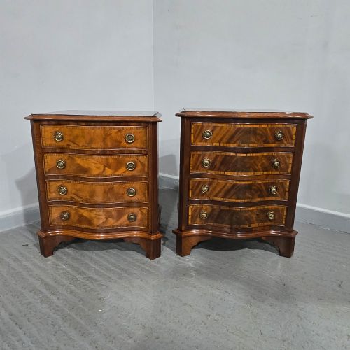 fig 1. A matching pair of serpentine-fronted mahogany bedside chests, each featuring four drawers with inlay crossbanding and circular brass ring handles.