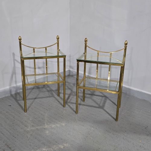 fig 1. Pair of two-tier brass side tables with clear glass shelves and decorative finials.