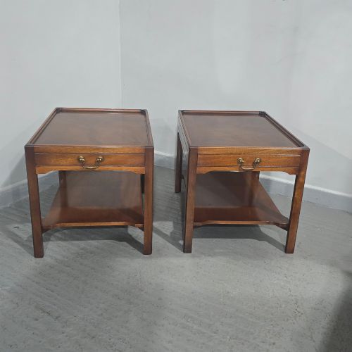 fig 1. A pair of solid mahogany lamp end tables featuring tray tops, single drawers with brass handles, and lower tier shelves.
