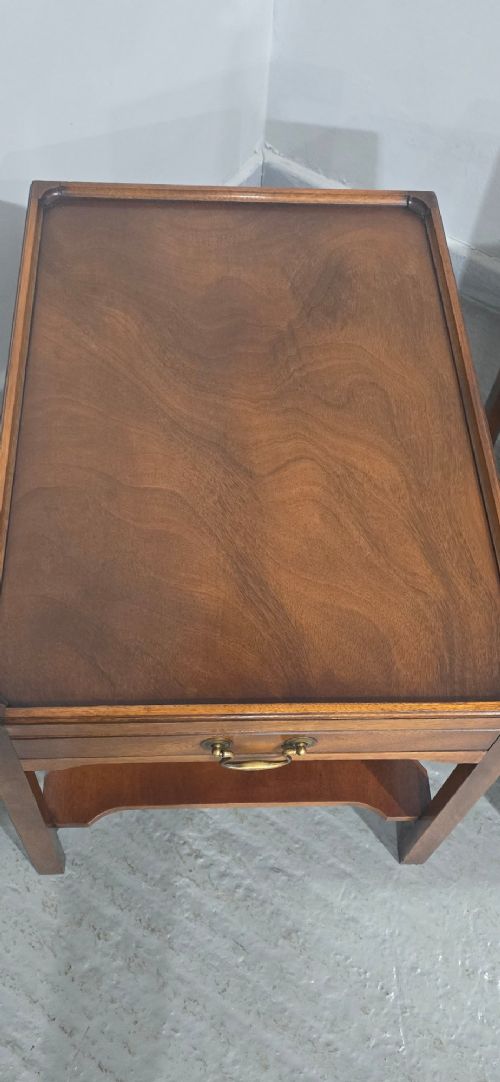A pair of solid mahogany lamp end tables featuring tray tops, single drawers with brass handles, and lower tier shelves. View VII