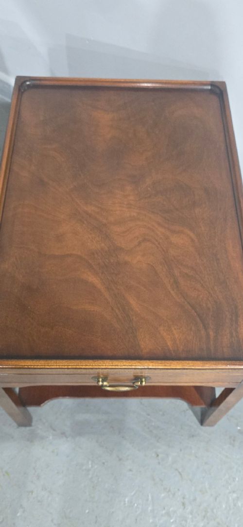 A pair of solid mahogany lamp end tables featuring tray tops, single drawers with brass handles, and lower tier shelves. View VIII
