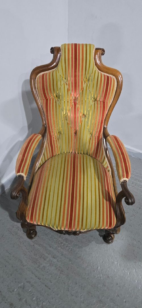 A Regency rosewood armchair featuring a button-tufted backrest, scrolled arms, carved legs, and striped green and red upholstery. View VI