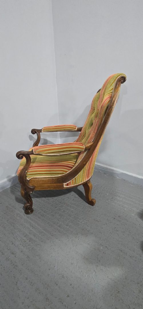 A Regency rosewood armchair featuring a button-tufted backrest, scrolled arms, carved legs, and striped green and red upholstery. View VIII